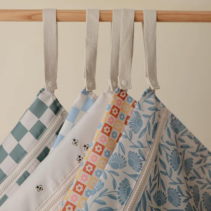mushie Water Resistant Wet Bags | Large & Small Reusable Storage Bag for Baby Items and Travel | Zippered Pockets with Handle | Machine Washable, Set of 2 (Blue Flowers)
